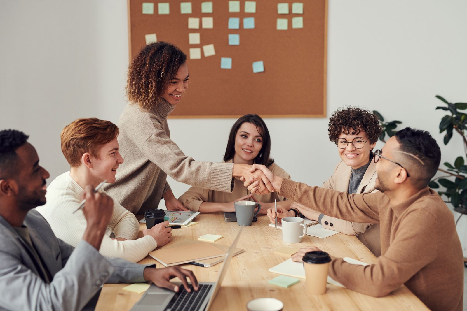 Business colleagues reviewing a financing agreement together at a bright office table